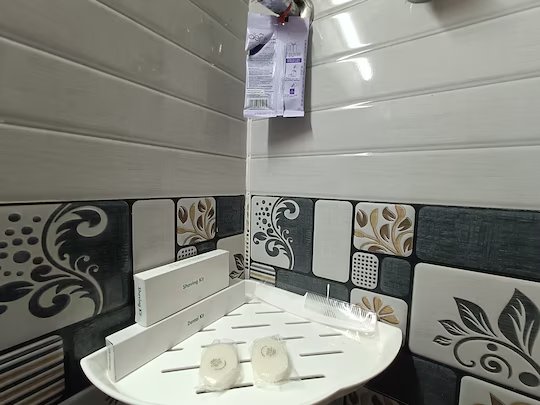 Bathroom corner shelf with toiletries